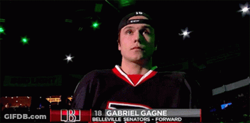 A Hockey Player Named Gabriel Gagne Is Standing In A Dark Room GIF