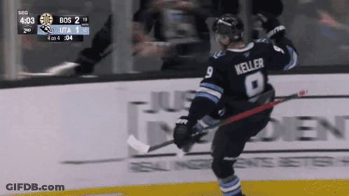 A Hockey Player Named Keller Is Holding A Hockey Stick GIF