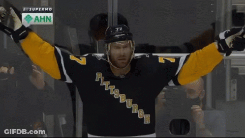 A Hockey Player Named Ruhwedel Is Hugging Another Player GIF
