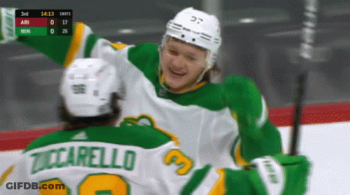 A Hockey Player Named Tuccarello Is Hugging Another Hockey Player GIF