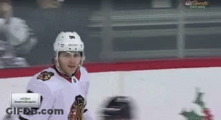 A Hockey Player On The Ice With A Nbc Sports Chicago Advertisement In The Corner GIF