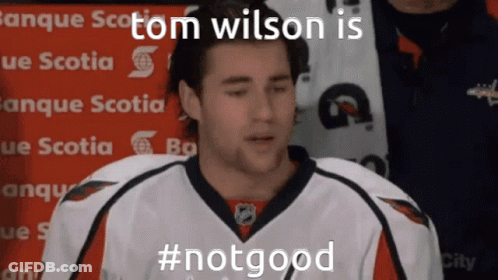 A Hockey Player Says Tom Wilson Is #Notgood In Front Of A Sign That Says Banque Scotia GIF