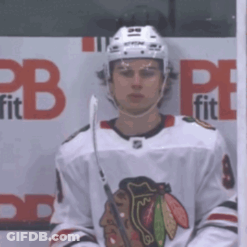 A Hockey Player Stands In Front Of A Cb Fit Sign GIF
