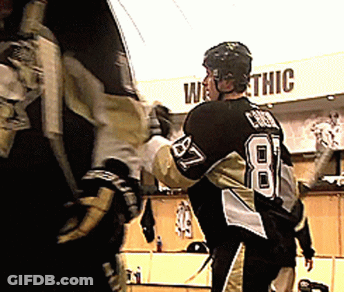 A Hockey Player Stands In Front Of A Sign That Says " Westthic " GIF