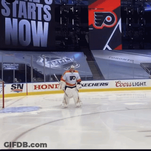 A Hockey Player Stands On The Ice In Front Of A Sign That Says Starts Now GIF