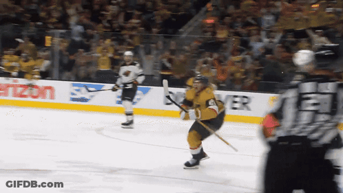 A Hockey Player Stands On The Ice In Front Of A Verizon Advertisement GIF