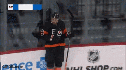 A Hockey Player Wearing A Black Jersey With The Number 3 On It GIF