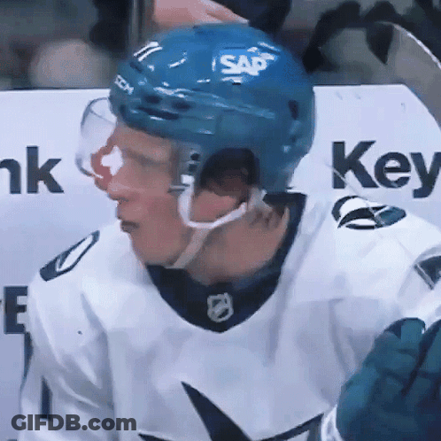A Hockey Player Wearing A Blue Helmet With Sap Written On It GIF