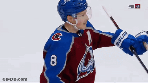 A Hockey Player Wearing A Blue Helmet With The Letter C On His Chest GIF