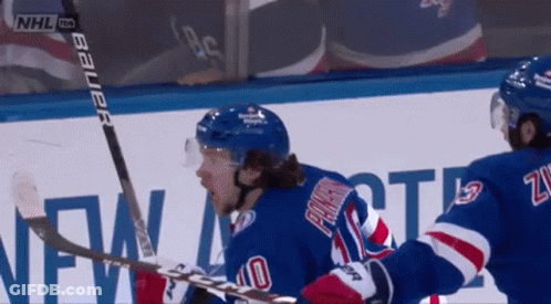 A Hockey Player Wearing A Blue Jersey With The Number 40 On It GIF