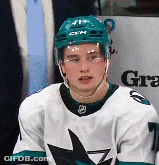 A Hockey Player Wearing A Ccm Helmet And Glasses GIF