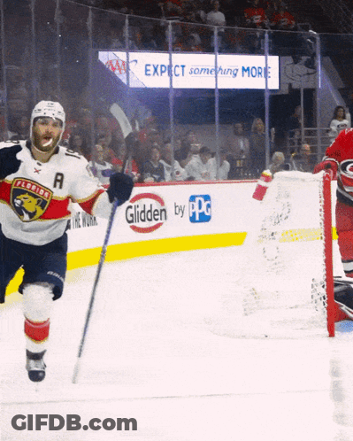 A Hockey Player Wearing A Florida Panthers Jersey Stands On The Ice In Front Of A Glidden By Ppg Sign GIF