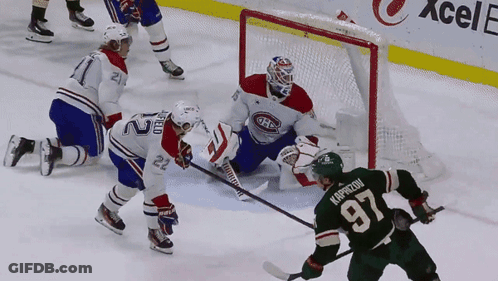 A Hockey Player Wearing A Green Jersey With The Letter A On The Sleeve GIF