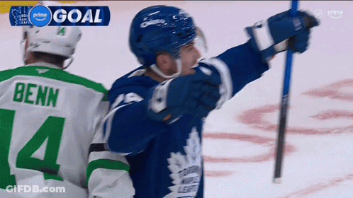 A Hockey Player Wearing A Green Jersey With The Number 14 On It GIF