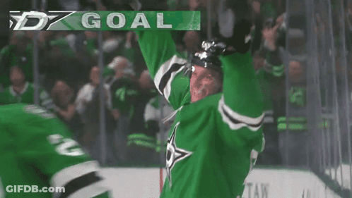 A Hockey Player Wearing A Green Jersey With The Number 2 On It GIF