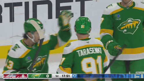 A Hockey Player Wearing A Green Jersey With The Number 91 GIF