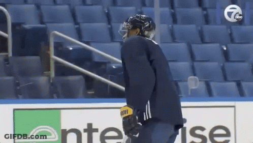 A Hockey Player Wearing A Helmet And A Bauer Jersey GIF