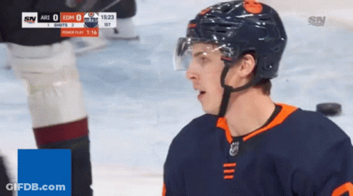 A Hockey Player Wearing A Helmet Stands On The Ice During A Game Against The Arizona Coyotes GIF