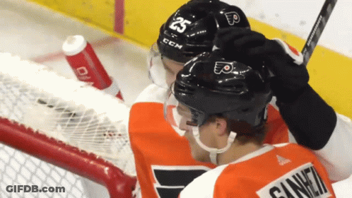A Hockey Player Wearing A Helmet That Says 25 On It GIF