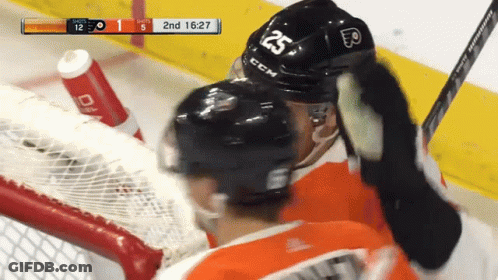 A Hockey Player Wearing A Helmet That Says 25 On It GIF
