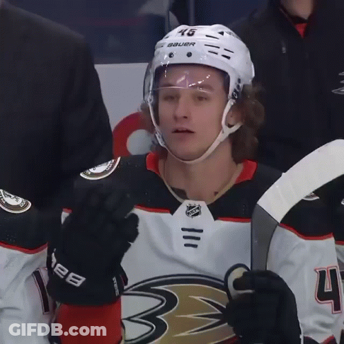 A Hockey Player Wearing A Helmet That Says Bauer GIF