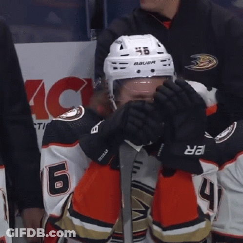 A Hockey Player Wearing A Helmet That Says Bauer On It GIF