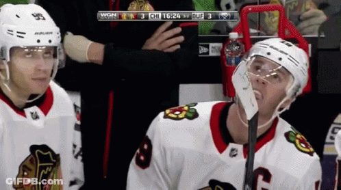 A Hockey Player Wearing A Helmet That Says Bauer On It GIF