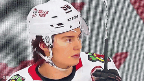 A Hockey Player Wearing A Helmet That Says Ccm GIF