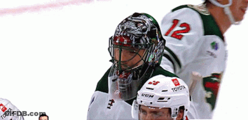 A Hockey Player Wearing A Helmet That Says Toyota GIF