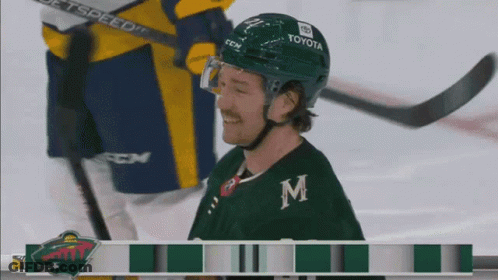 A Hockey Player Wearing A Helmet That Says Toyota GIF