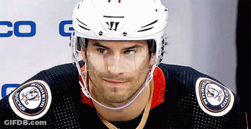 A Hockey Player Wearing A Helmet That Says Warrior On It GIF