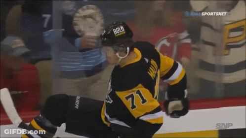A Hockey Player Wearing A Helmet With Bold On It GIF
