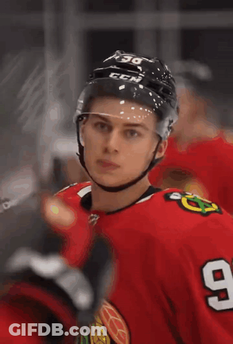 A Hockey Player Wearing A Helmet With The Letters Ccm On It GIF