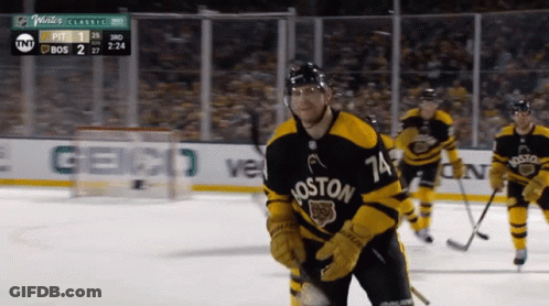 A Hockey Player Wearing A Jersey That Says Boston GIF