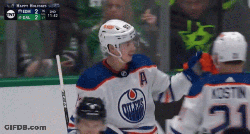 A Hockey Player Wearing A Jersey That Says Edmonton Oilers On It GIF