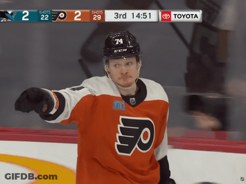 A Hockey Player Wearing A Jersey That Says Flyers Is Pointing At Something GIF