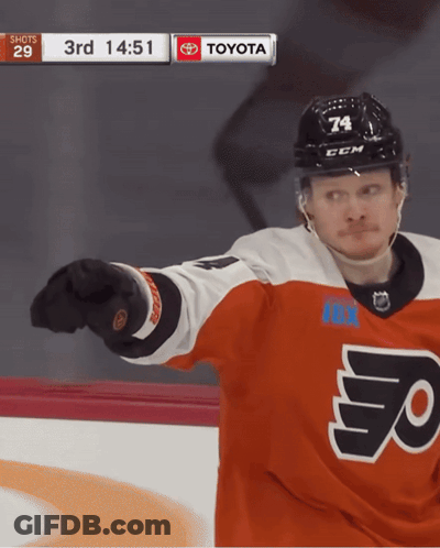 A Hockey Player Wearing A Jersey That Says Flyers Is Pointing At The Camera GIF