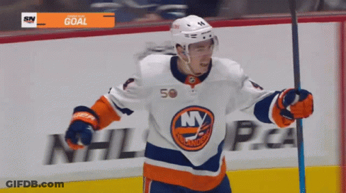 A Hockey Player Wearing A Jersey That Says Ny Is Holding A Stick GIF