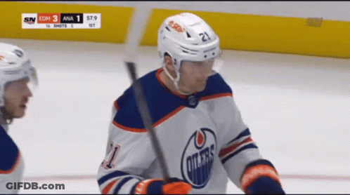 A Hockey Player Wearing A Jersey That Says Oilers GIF