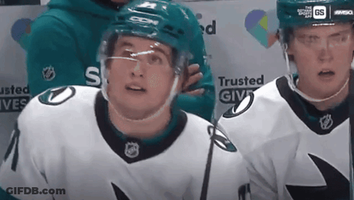 A Hockey Player Wearing A Jersey That Says Trusted Give GIF