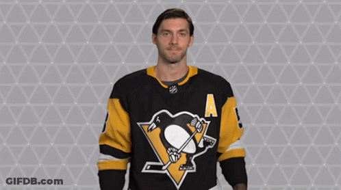 A Hockey Player Wearing A Jersey With A Penguin On It GIF