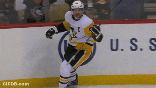 A Hockey Player Wearing A Jersey With The Letter C On It GIF
