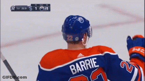 A Hockey Player Wearing A Jersey With The Name Barrie On It GIF