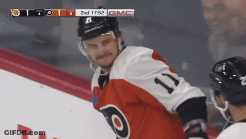 A Hockey Player Wearing A Jersey With The Number 11 GIF