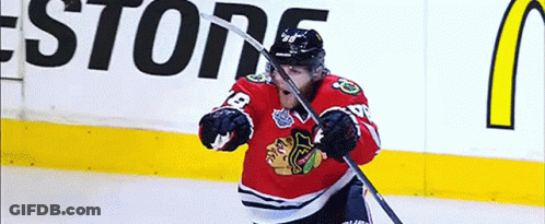 A Hockey Player Wearing A Jersey With The Number 12 On It GIF