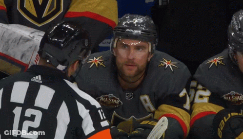 A Hockey Player Wearing A Jersey With The Number 12 On It GIF