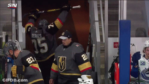 A Hockey Player Wearing A Jersey With The Number 15 On It GIF