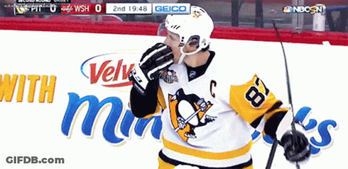 A Hockey Player Wearing A Jersey With The Number 18 On It GIF