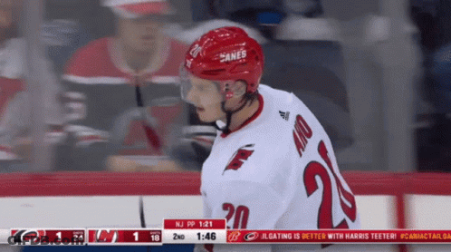 A Hockey Player Wearing A Jersey With The Number 20 GIF