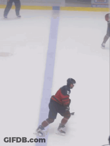 A Hockey Player Wearing A Jersey With The Number 23 On It GIF